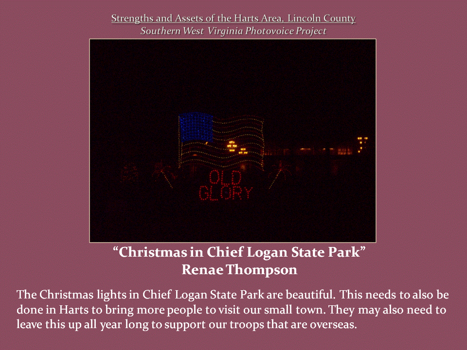 Red, white, and blue Christmas lights form an American flag above the words "Old Glory" against a dark sky.
