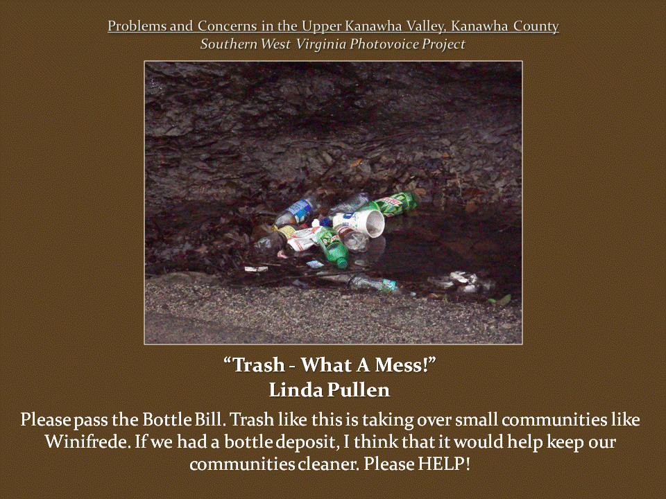 Discarded plastic bottles, soda cans, and disposable cups collected in a muddy roadside ditch filled with leaves and debris.