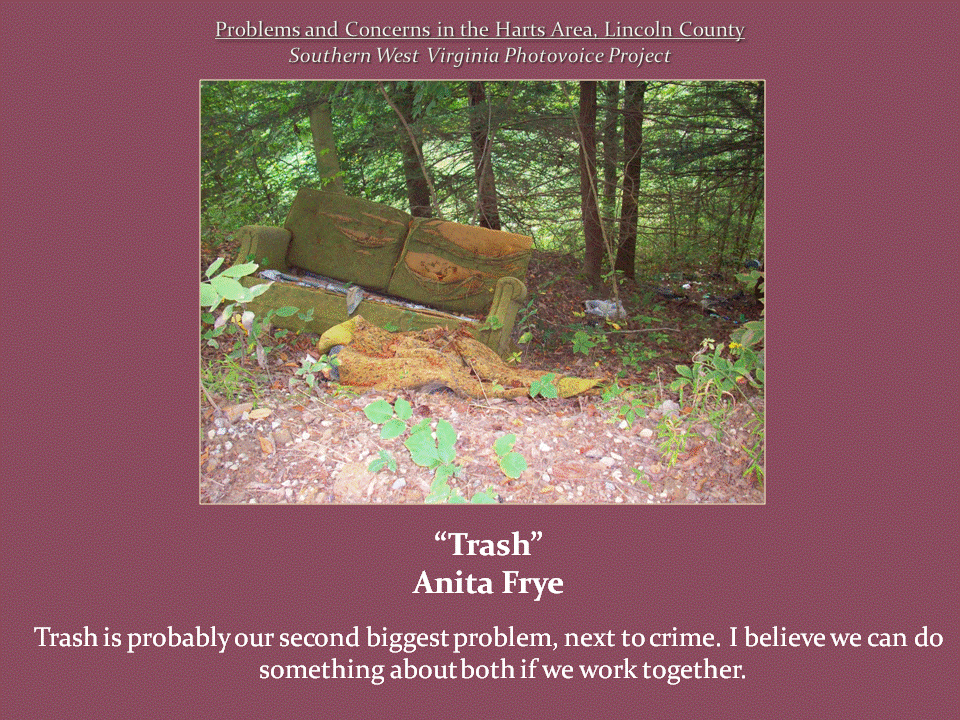 An abandoned, deteriorating sofa surrounded by scattered litter in a wooded area.