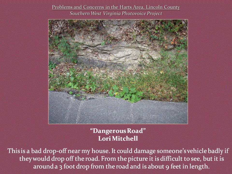 A section of pavement ends abruptly beside a steep roadside drop-off and exposed rock embankment.