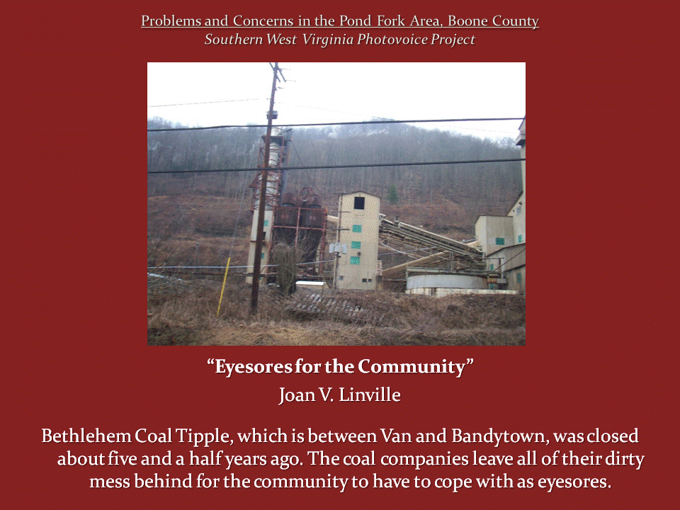 The abandoned Bethlehem Coal Tipple stands against a wooded hillside, with industrial towers, conveyors, and power lines.