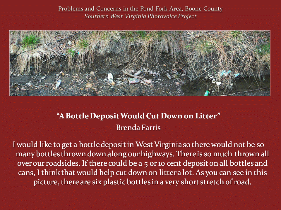 Several discarded plastic bottles and other trash lie along a muddy roadside ditch beneath an eroded grassy bank.